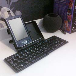 A Palm TX sitting in a Palm folding keyboard
