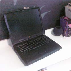 A black PowerBook laptop