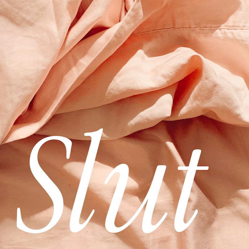 'Slut' zine cover, a square closeup image of pink bed sheets with the text Slut written in a big, white, italic, serif font.